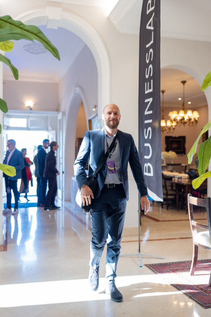 A guest arriving past the BusinessLabs banner.