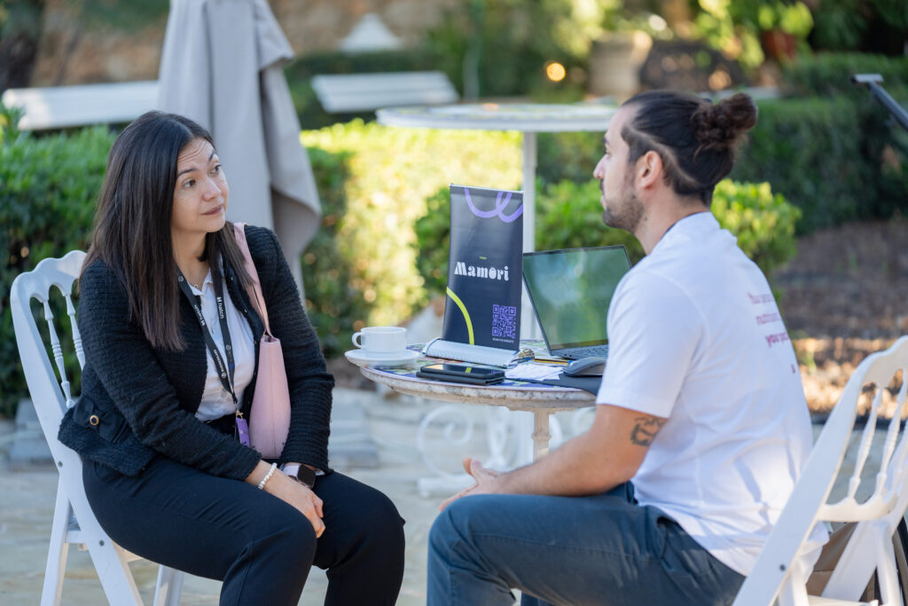 Mamori, a healthy-eating platform, talking with a visitor at the lunchtime expo.