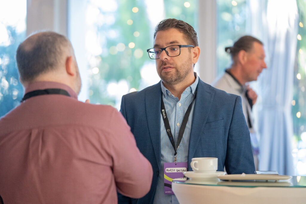 Dr Mario Balzan in conversation during a coffee break.