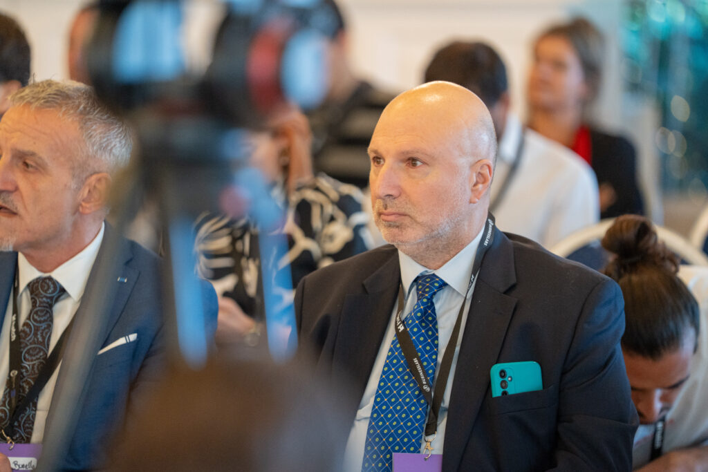 An attendee listening during the panels.